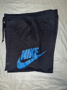 Nike Men’s Black Athletic Shorts with Blue Swoosh